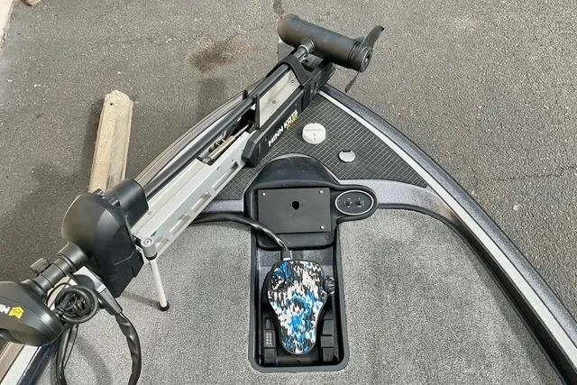 Slide: The Image of 2013 Triton 18XS boat deck with trolling motor and foot pedal. - 16