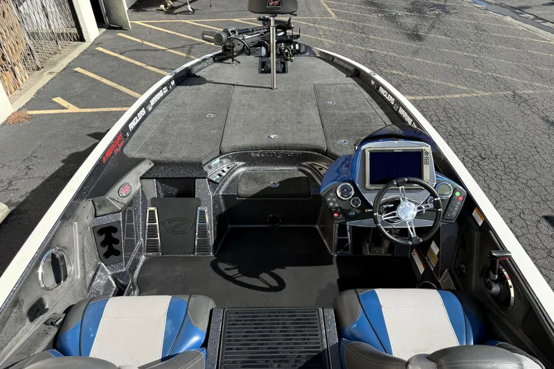 Slide: The Image of 2017 Ranger Z520 Comanche boat interior with steering wheel and navigation system. - 2
