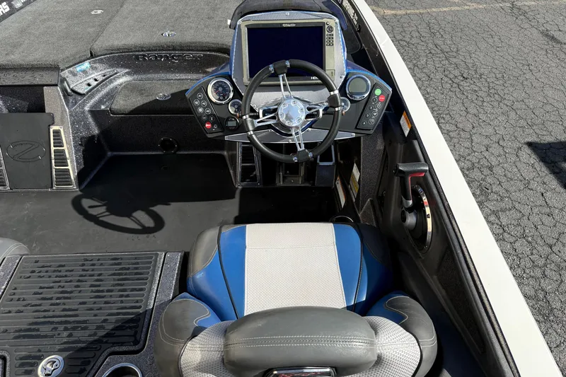 Slide: The Image of 2017 Ranger Z520 Comanche boat cockpit with steering wheel and control panel. - 4