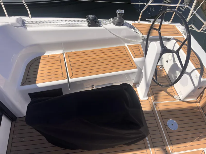 Slide: The Image of 2026 Hanse 348 yacht cockpit with teak flooring and steering wheel. - 11