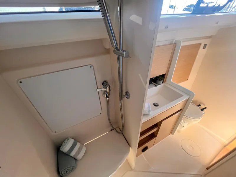 Slide: The Image of Bathroom interior of 2026 Hanse 348 yacht, featuring shower, sink, and storage. - 16