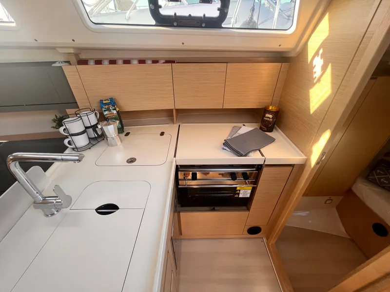 Slide: The Image of Modern kitchen interior of 2026 Hanse 348 yacht, featuring sleek cabinetry and appliances. - 18