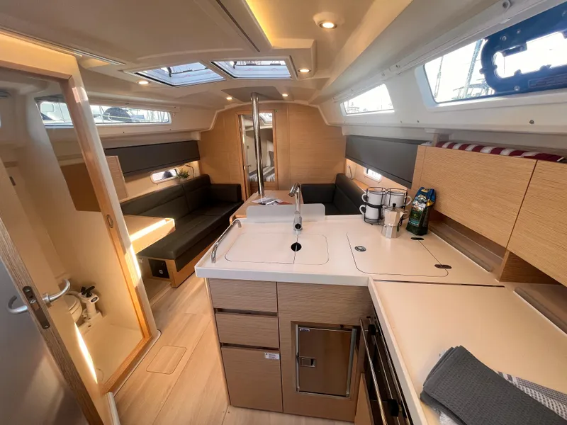 Slide: The Image of Modern interior of 2026 Hanse 348 yacht with sleek kitchen and seating area. - 3