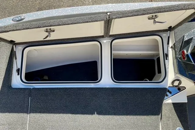 Slide: The Image of 2020 Ranger Z520L boat storage compartments open, showcasing spacious interior design. - 13