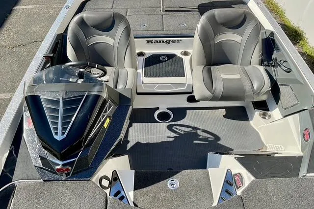 Slide: The Image of 2020 Ranger Z520L boat interior with dual seats and steering console. - 14