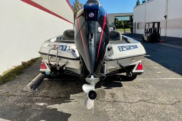 Slide: The Image of 2020 Ranger Z520L boat with powerful outboard motor, parked outdoors on concrete surface. - 21