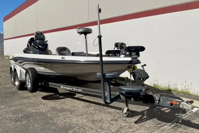 Slide: The Image of 2020 Ranger Z520L boat on trailer, parked outdoors, side view. - 23