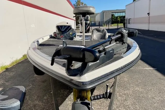 Slide: The Image of 2020 Ranger Z520L bass boat with trolling motor in a parking lot. - 26