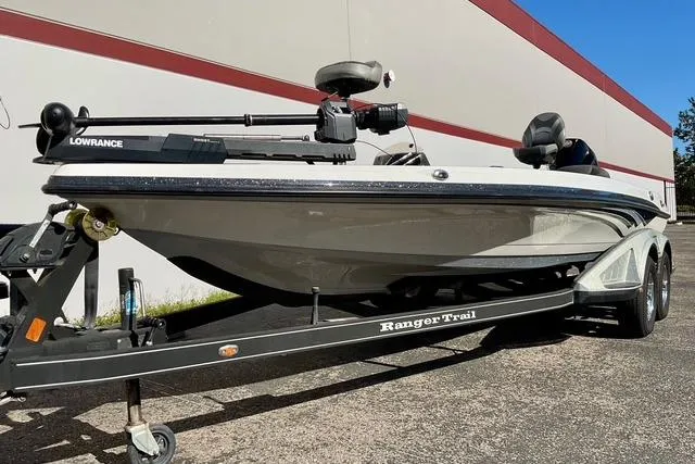 Slide: The Image of 2020 Ranger Z520L boat on trailer, featuring Lowrance equipment, parked outdoors. - 28