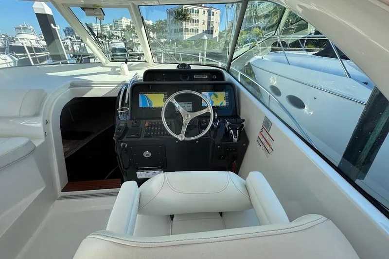 Slide: The Image of 2021 Pursuit OS 385 Offshore helm with modern navigation system and luxurious seating. - 19