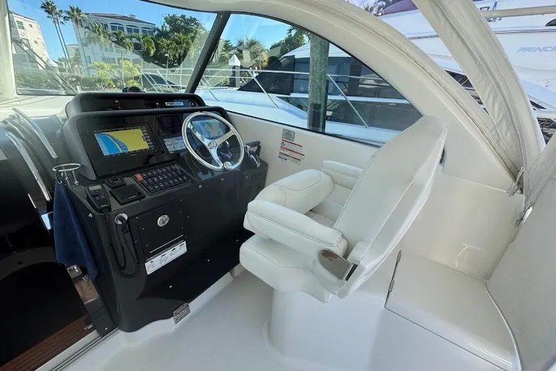 Slide: The Image of 2021 Pursuit OS 385 Offshore helm with modern navigation equipment and comfortable seating. - 23