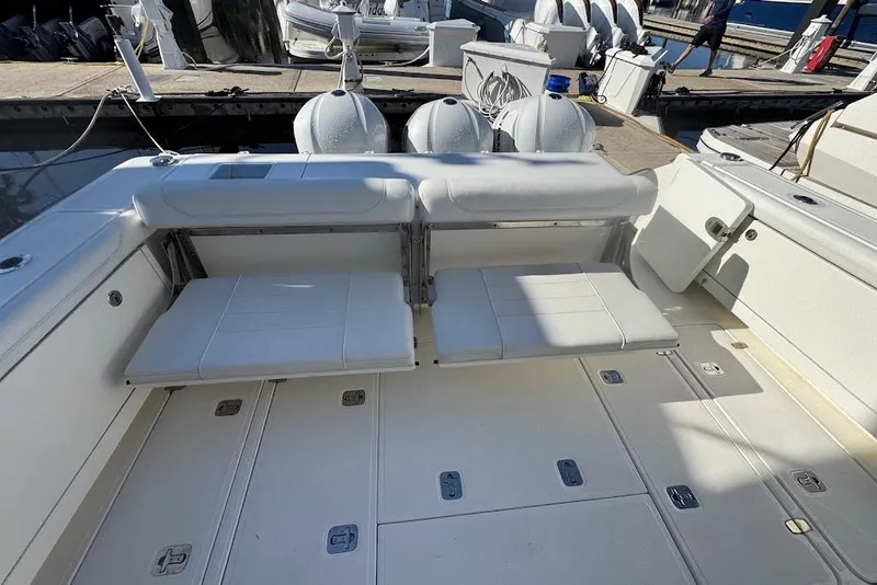 Slide: The Image of 2021 Pursuit OS 385 Offshore boat with foldable seating and spacious deck layout. - 33