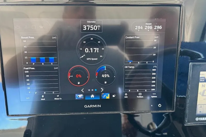 Slide: The Image of Garmin display on 2021 Pursuit OS 385 Offshore showing engine metrics and GPS speed. - 36
