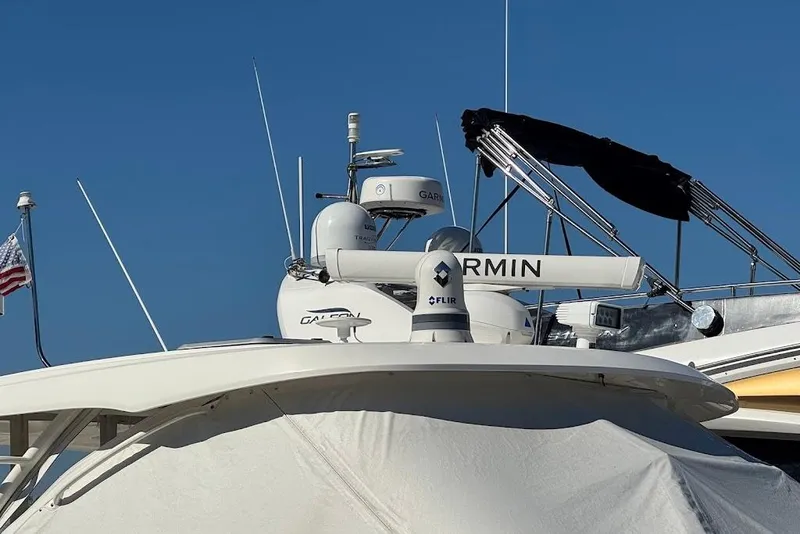 Slide: The Image of 2021 Pursuit OS 385 Offshore boat with Garmin and FLIR equipment, blue sky background. - 41