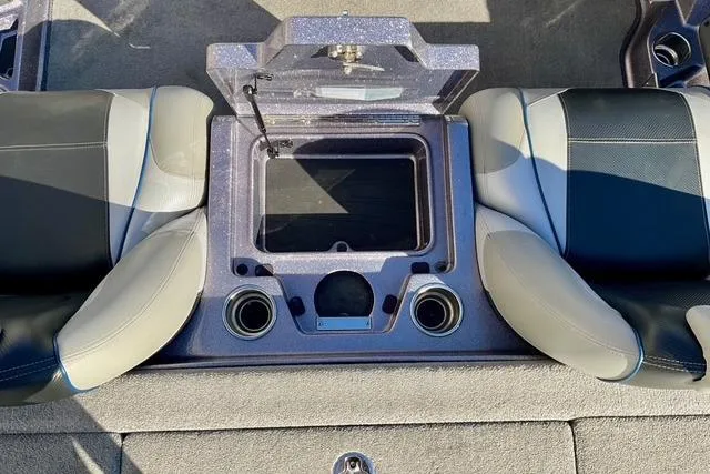 Slide: The Image of 2015 Ranger Z518 Comanche boat interior with storage compartment and seating. - 11