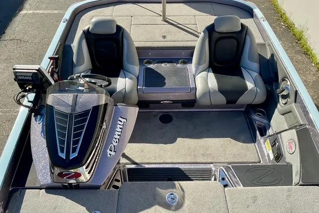 Slide: The Image of 2015 Ranger Z518 Comanche boat interior with dual seats and control panel. - 15