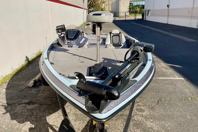 Slide: The Image of 2015 Ranger Z518 Comanche bass boat parked outdoors. - 3