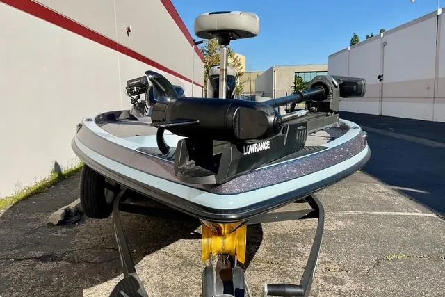 Slide: The Image of 2015 Ranger Z518 Comanche boat with Lowrance equipment, parked outdoors. - 4