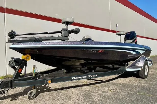 Slide: The Image of 2015 Ranger Z518 Comanche boat on trailer, parked outdoors. - 5