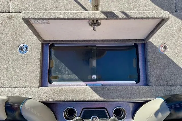 Slide: The Image of 2015 Ranger Z518 Comanche boat interior with open storage compartment. - 9