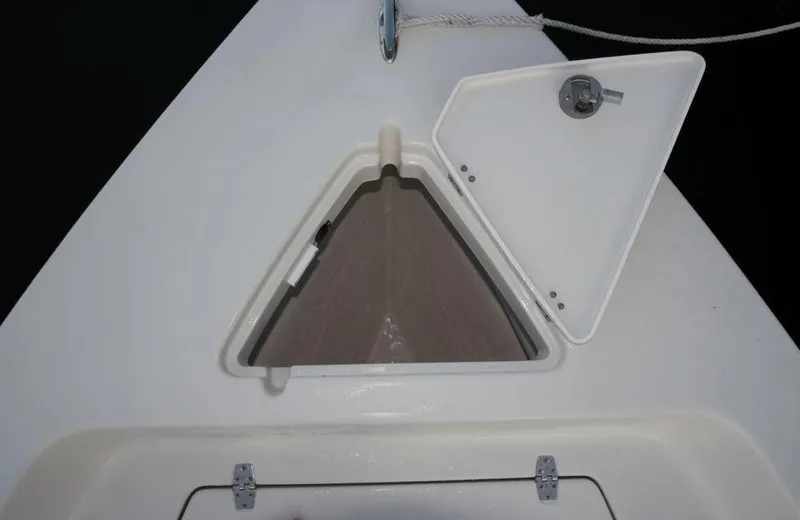 Slide: The Image of Manufacturer Provided Image: 2019 Cobia 21 Bay boat with open storage compartment. - 10