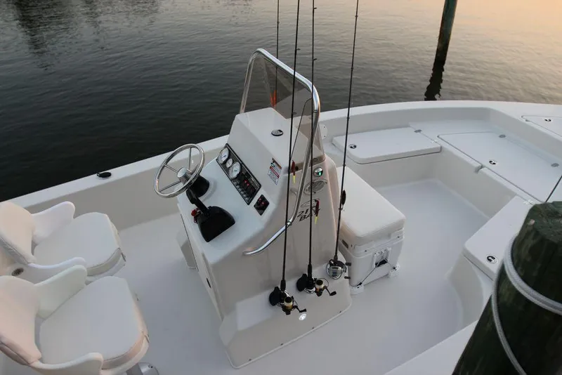 Slide: The Image of Manufacturer Provided Image: 2019 Cobia 21 Bay boat with center console and fishing rods. - 15