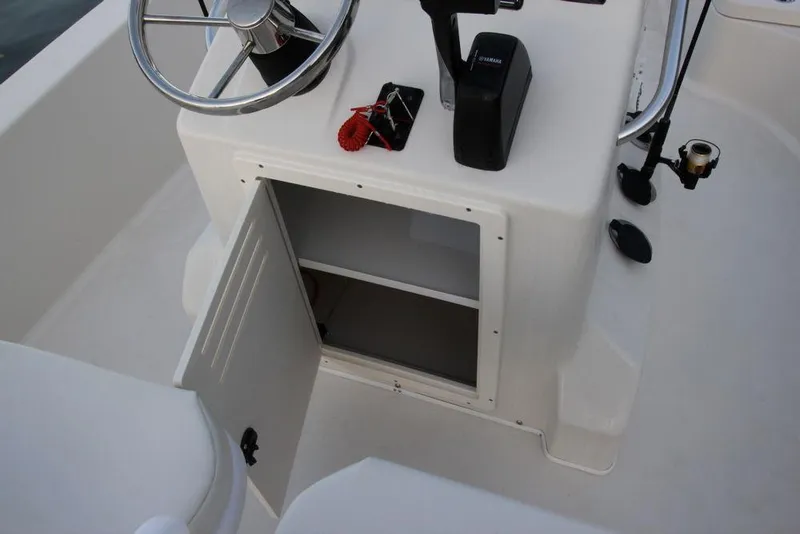 Slide: The Image of Manufacturer Provided Image: 2019 Cobia 21 Bay boat console with open storage compartment. - 17