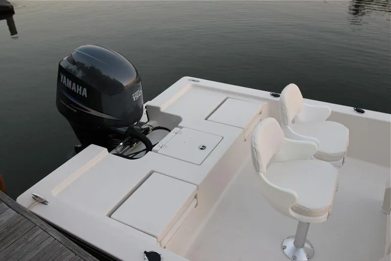 Slide: The Image of Manufacturer Provided Image: 2019 Cobia 21 Bay boat with Yamaha outboard motor and two white seats. - 19