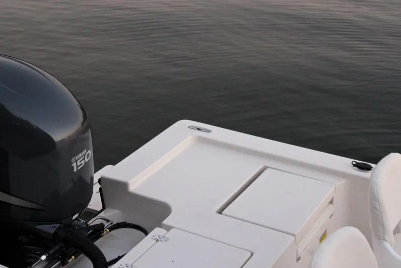 Slide: The Image of Manufacturer Provided Image: 2019 Cobia 21 Bay boat with Yamaha 150 outboard motor on calm water. - 20