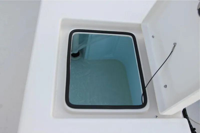 Slide: The Image of Manufacturer Provided Image: Open storage compartment on a 2019 Cobia 21 Bay boat. - 23