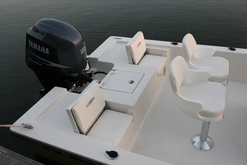 Slide: The Image of Manufacturer Provided Image: 2019 Cobia 21 Bay boat with Yamaha outboard motor and white seating. - 9