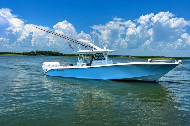 The Image of 2024 Yellowfin 39 Offshore boat on calm water under a blue sky. - 0