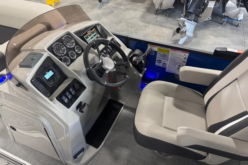 Slide: The Image of 2026 Sylvan X5 boat cockpit with modern controls and comfortable seating. - 9