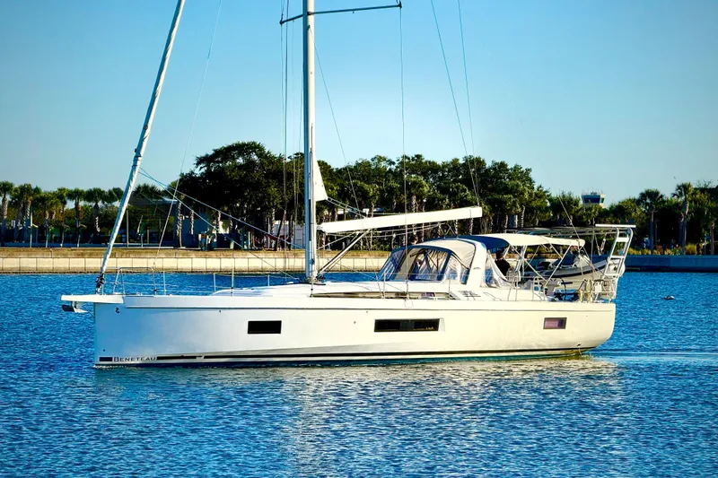 The Image of 2020 Beneteau Oceanis 51.1 sailboat on calm water, clear sky background. - 0