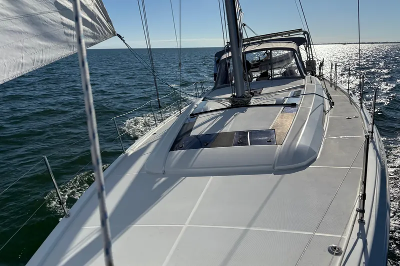 Slide: The Image of 2020 Beneteau Oceanis 51.1 sailing on open water under clear skies. - 32