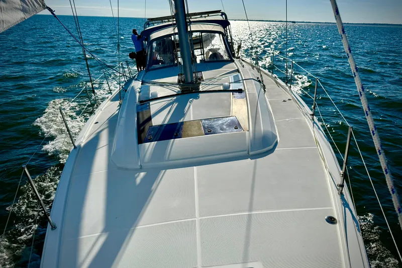 Slide: The Image of 2020 Beneteau Oceanis 51.1 sailing on open water under clear skies. - 34