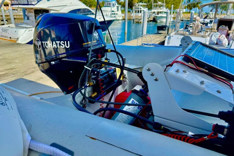Slide: The Image of Tohatsu outboard motor on a Beneteau Oceanis 51.1, docked at a marina, 2020 model. - 36