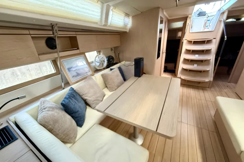Slide: The Image of Luxurious interior of 2020 Beneteau Oceanis 51.1 yacht with modern seating and wooden finishes. - 40
