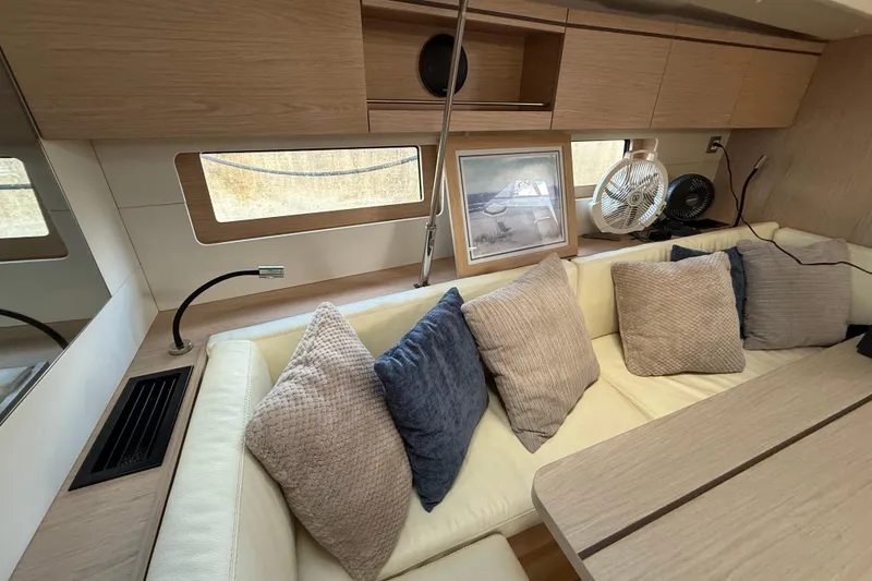 Slide: The Image of Interior of 2020 Beneteau Oceanis 51.1 yacht with cozy seating and decorative pillows. - 41