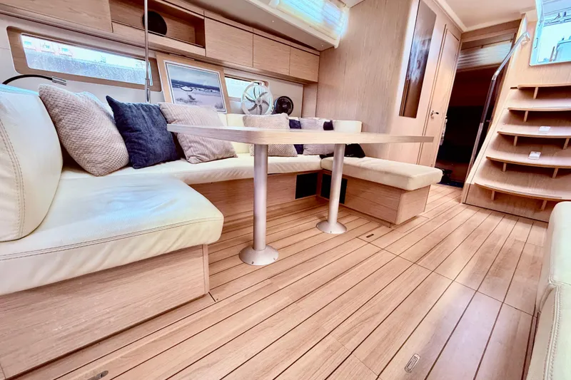 Slide: The Image of Luxurious interior of 2020 Beneteau Oceanis 51.1 yacht with elegant seating and wooden flooring. - 42