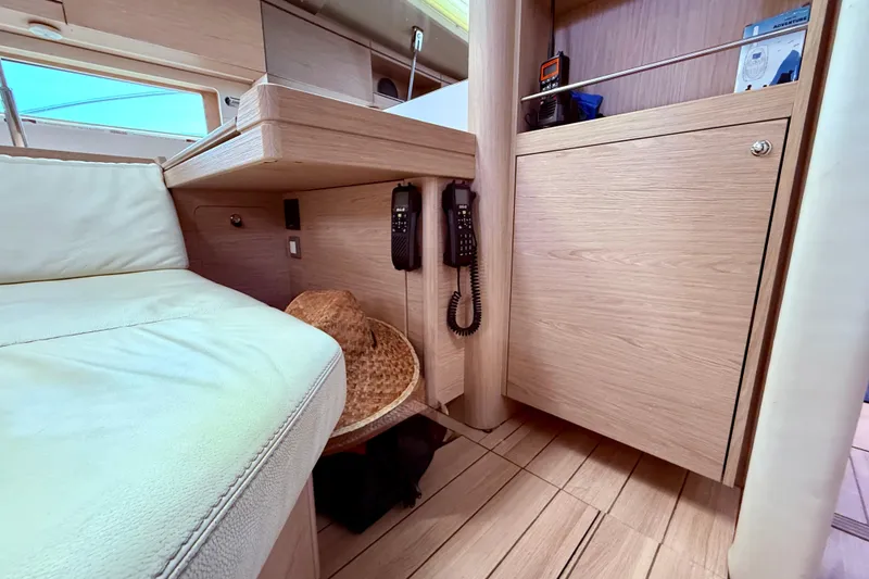 Slide: The Image of Interior of 2020 Beneteau Oceanis 51.1 yacht with wooden cabinetry and seating. - 43