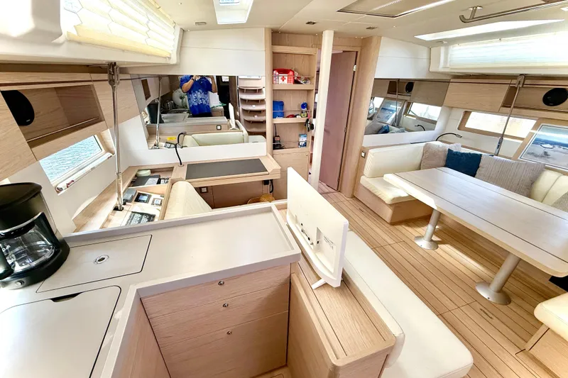 Slide: The Image of Luxurious interior of 2020 Beneteau Oceanis 51.1 yacht with modern kitchen and dining area. - 46