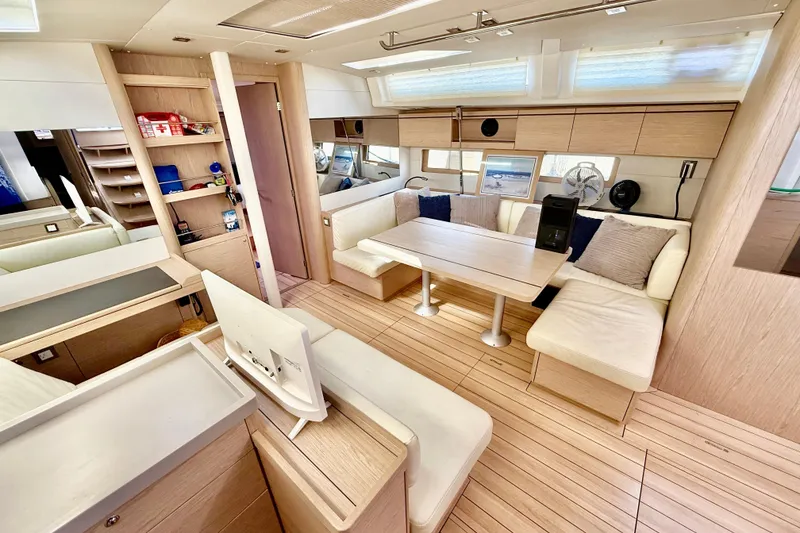 Slide: The Image of Luxurious interior of 2020 Beneteau Oceanis 51.1 yacht with modern seating and wooden finishes. - 48