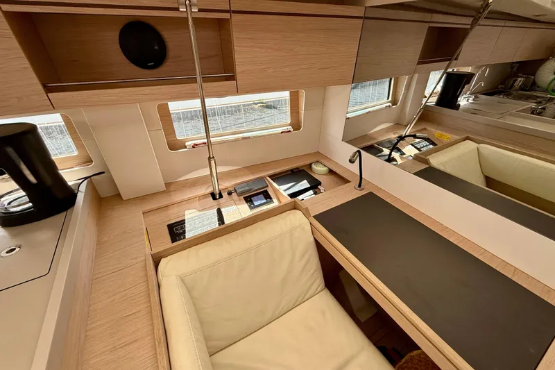 Slide: The Image of Luxurious interior of 2020 Beneteau Oceanis 51.1 yacht with modern wood finish. - 49