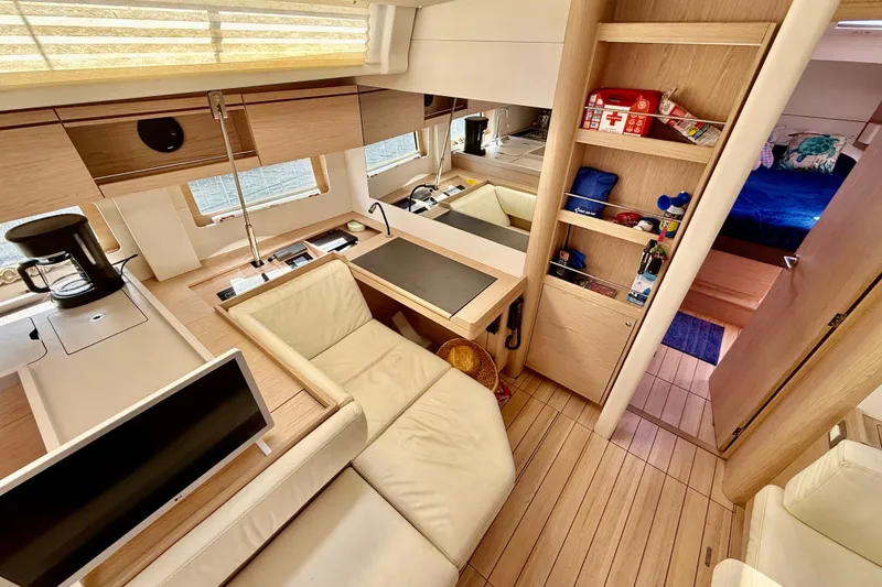Slide: The Image of Luxurious interior of 2020 Beneteau Oceanis 51.1 yacht with modern furnishings and ample storage. - 51