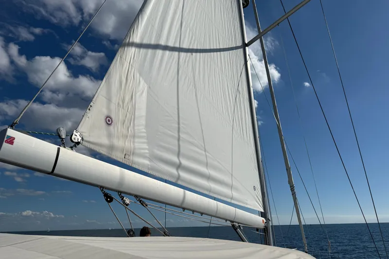 Slide: The Image of Sailing on a 2020 Beneteau Oceanis 51.1 under clear blue skies. - 53