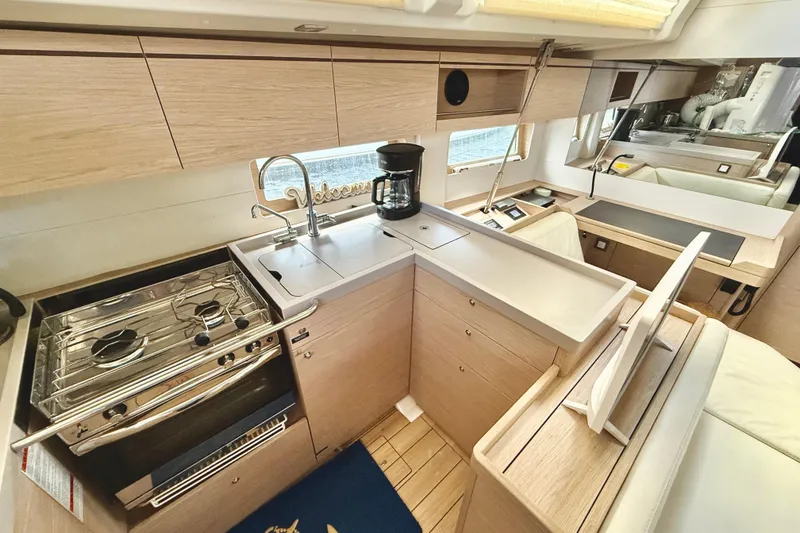 Slide: The Image of Modern kitchen interior of 2020 Beneteau Oceanis 51.1 yacht with stove and sink. - 64