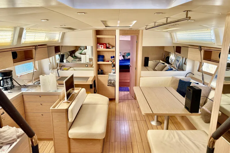 Slide: The Image of Interior of 2020 Beneteau Oceanis 51.1 yacht, featuring modern kitchen and cozy seating area. - 69