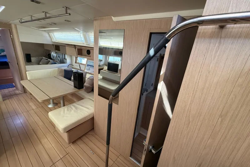 Slide: The Image of Luxurious interior of 2020 Beneteau Oceanis 51.1 yacht with modern furnishings and wood finish. - 70