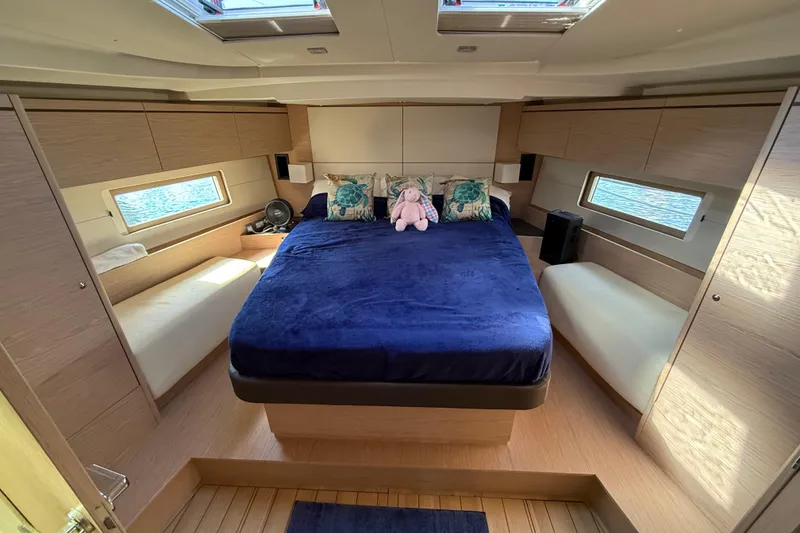 Slide: The Image of Luxurious cabin interior of 2020 Beneteau Oceanis 51.1 yacht with plush bedding. - 71